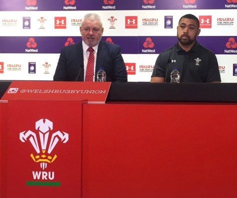 An impassive Toby Felatau (right) listens to his coach Warren Gatland talk about the Italy game.